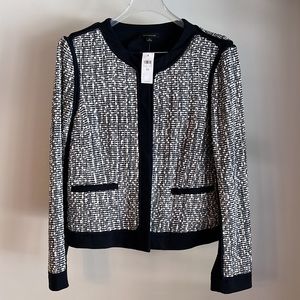 And Taylor navy suit with ivory tweed. Jacket size 10  skirt size 8.
